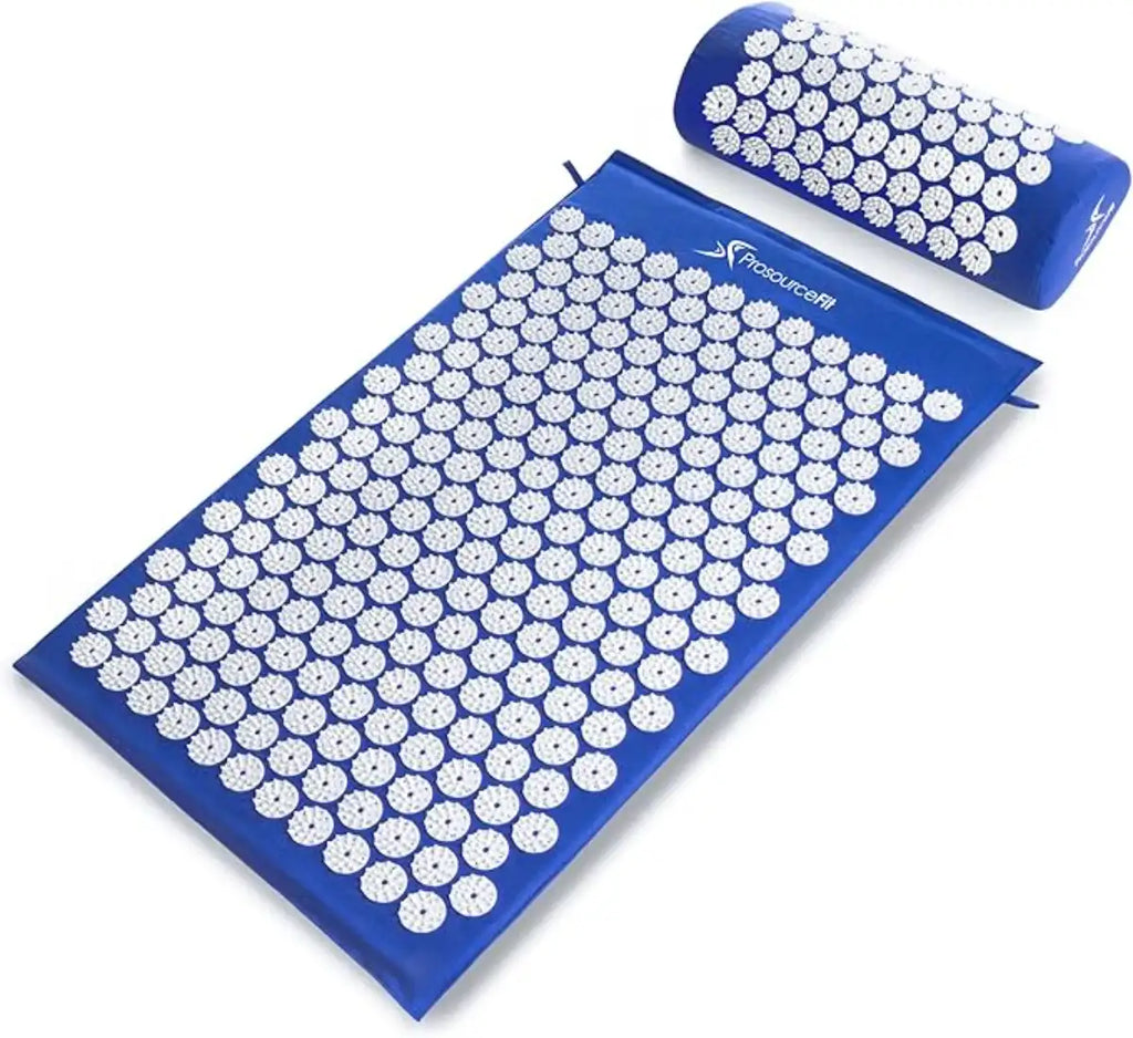 Blue acupressure mat with white nodes and matching pillow on a white background