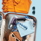 Open suitcase with travel items including an orange shirt, sunglasses, a water bottle, and a watch on a light blue background.