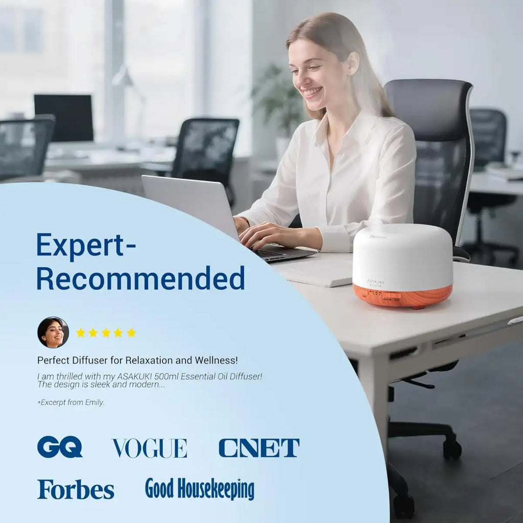 Woman using a laptop in an office with a diffuser on the desk, surrounded by credibility badges.