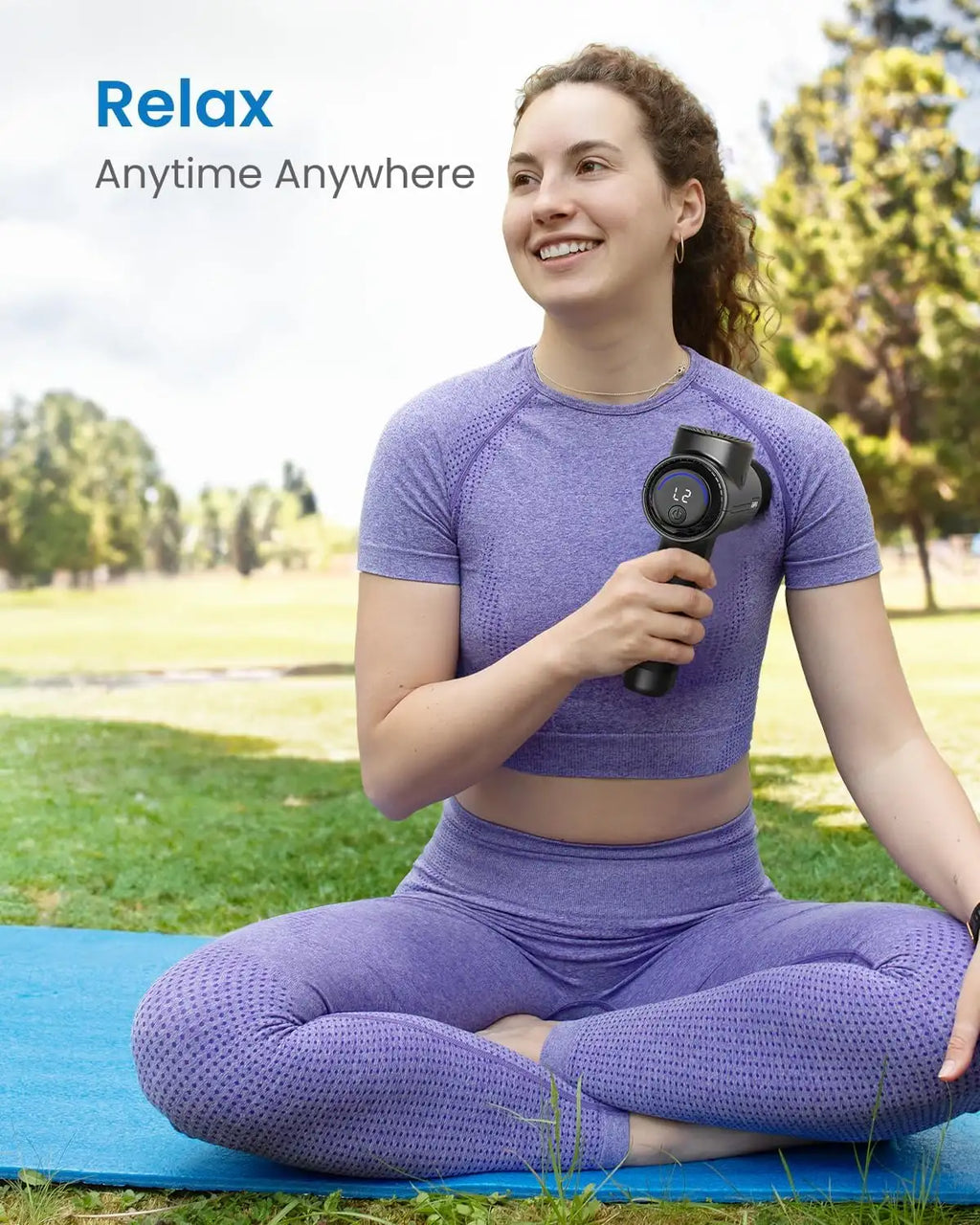 Woman in purple workout gear holding a massage gun with 'Relax Anytime Anywhere' text in a park setting.