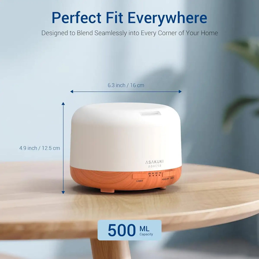 White and orange humidifier on a wooden table with dimensions and capacity details.