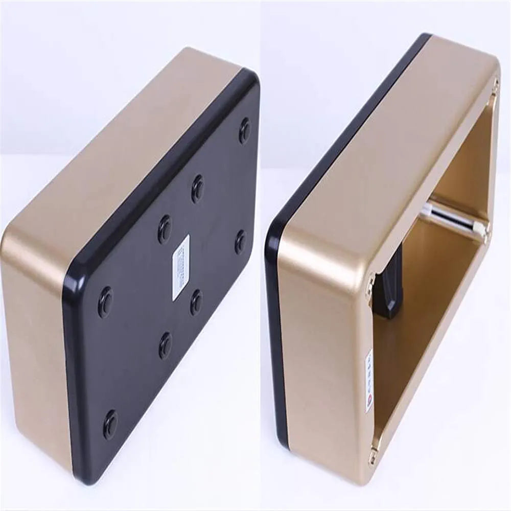 Gold and black rectangular device on a white background