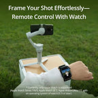 Smartwatch controlling a camera setup on a grassy field