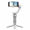 White smartphone gimbal with phone attached on a white background