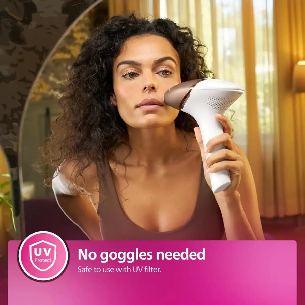 Woman using a handheld device with a UV Protect logo, indicating safety with a UV filter.