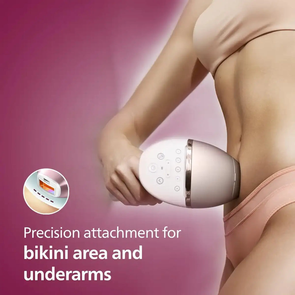 Person using a precision attachment for bikini area and underarms on a pink background