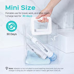 Portable electronic device with charging cable and cleaning brush, held by a hand, on a light gray background.