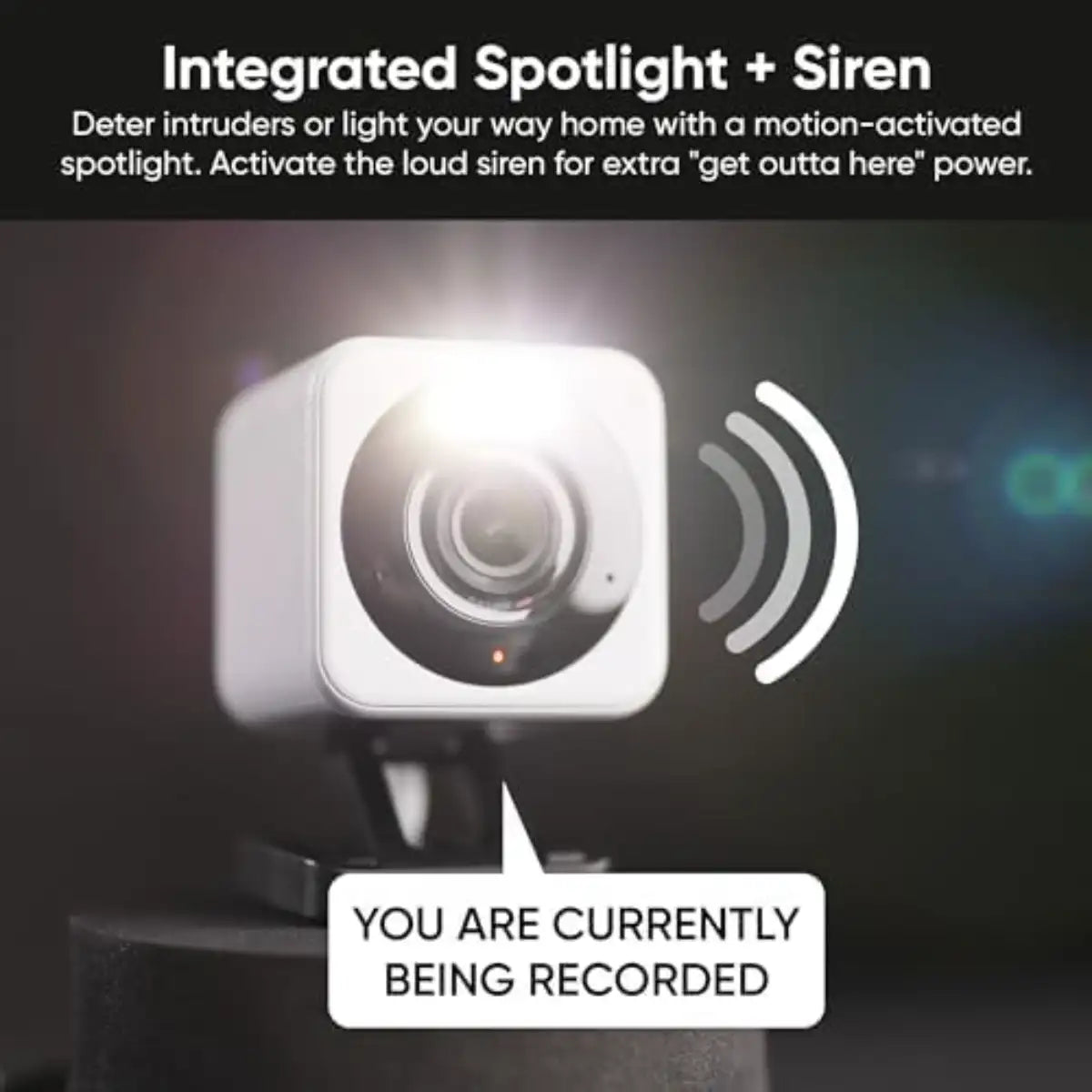 Security camera with spotlight and siren feature on a dark background