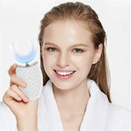 Woman holding a white electronic device with a blue light on a white background