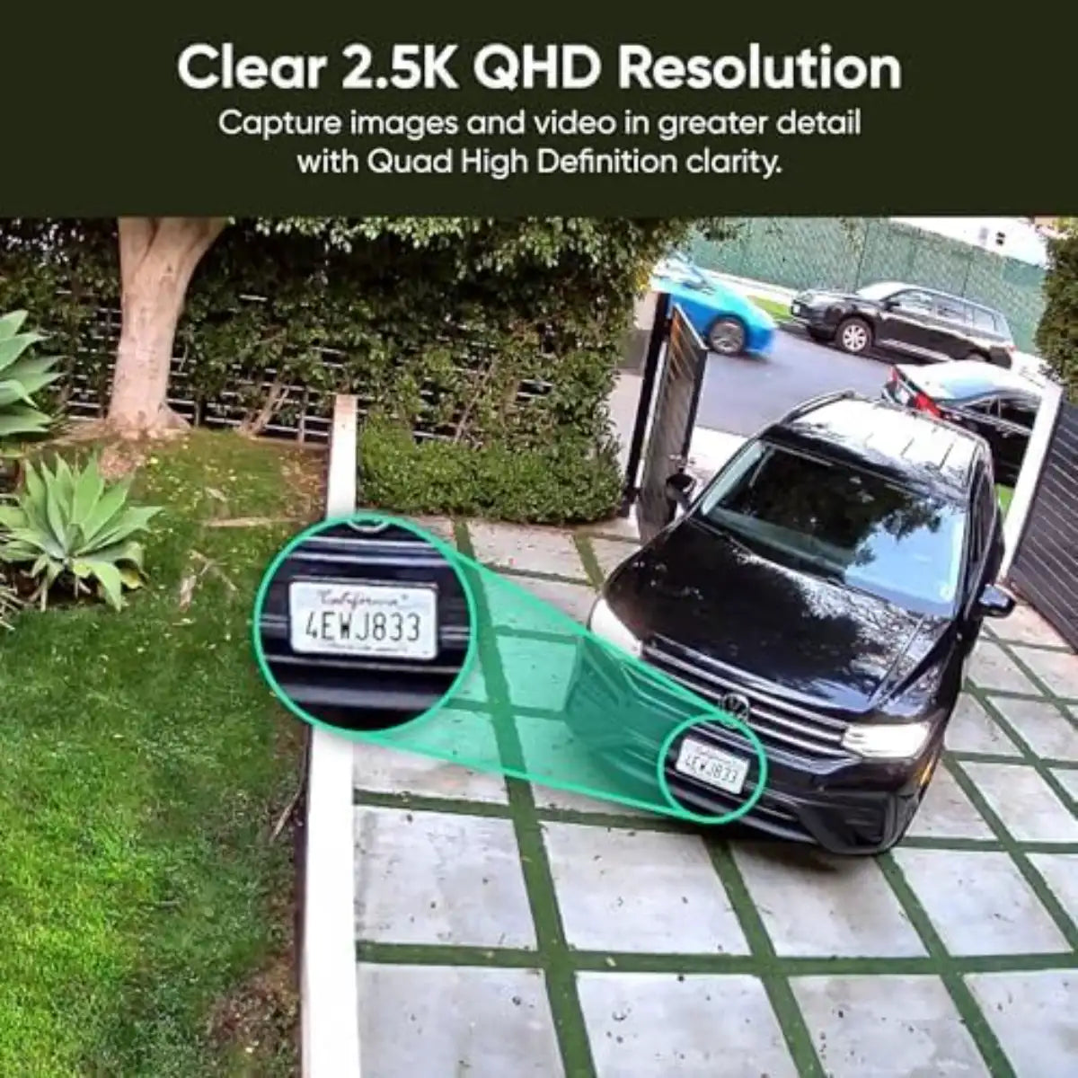 Car parked on a driveway with a clear 2.5K QHD resolution text overlay.