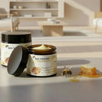 Jar of 'Bee Venom' cream with a honeycomb and bee on a neutral background