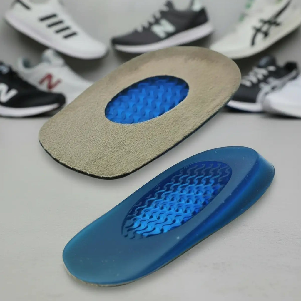 Blue and beige shoe insole with blurred shoes in the background
