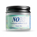 Jar of NOBS toothpaste with a black lid on a white background