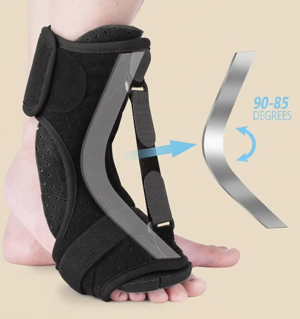 Black foot orthosis with adjustable strap on a beige background